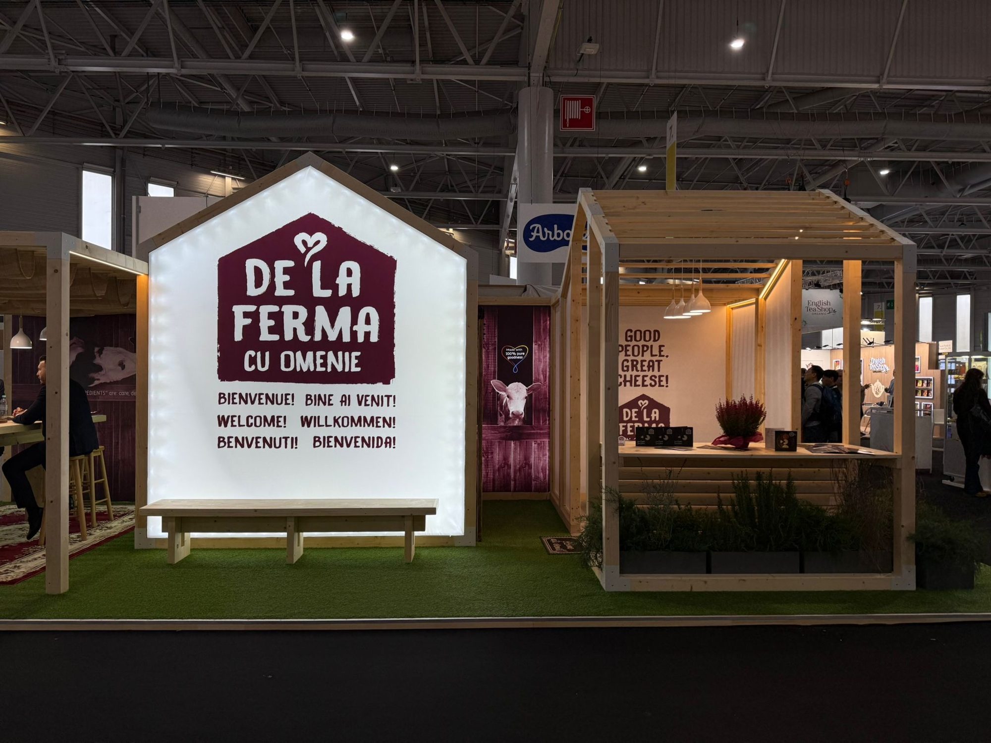 Light-box house with the Ferma cu Omenie logo and tasting bar